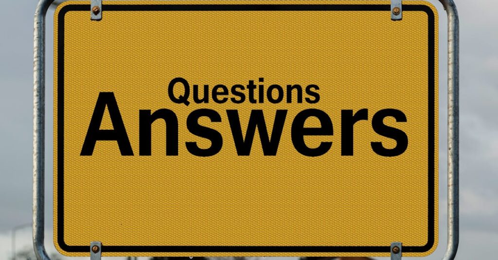 Yellow sign with text questions and answers suggesting direction in decision-making.
