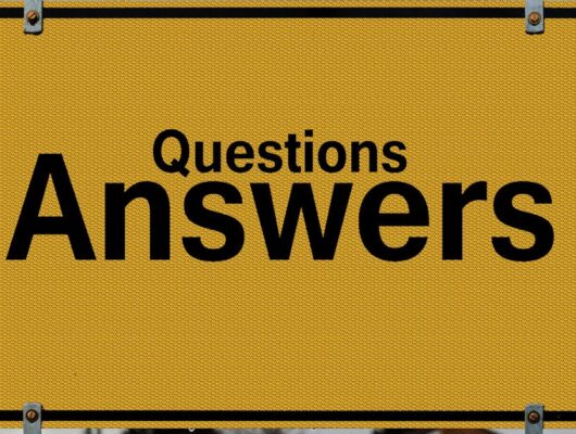Yellow sign with text questions and answers suggesting direction in decision-making.